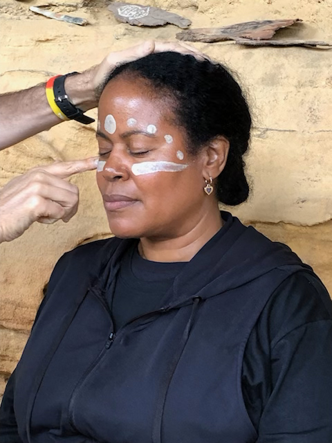 A traveler is invited to experience face painting in Australia